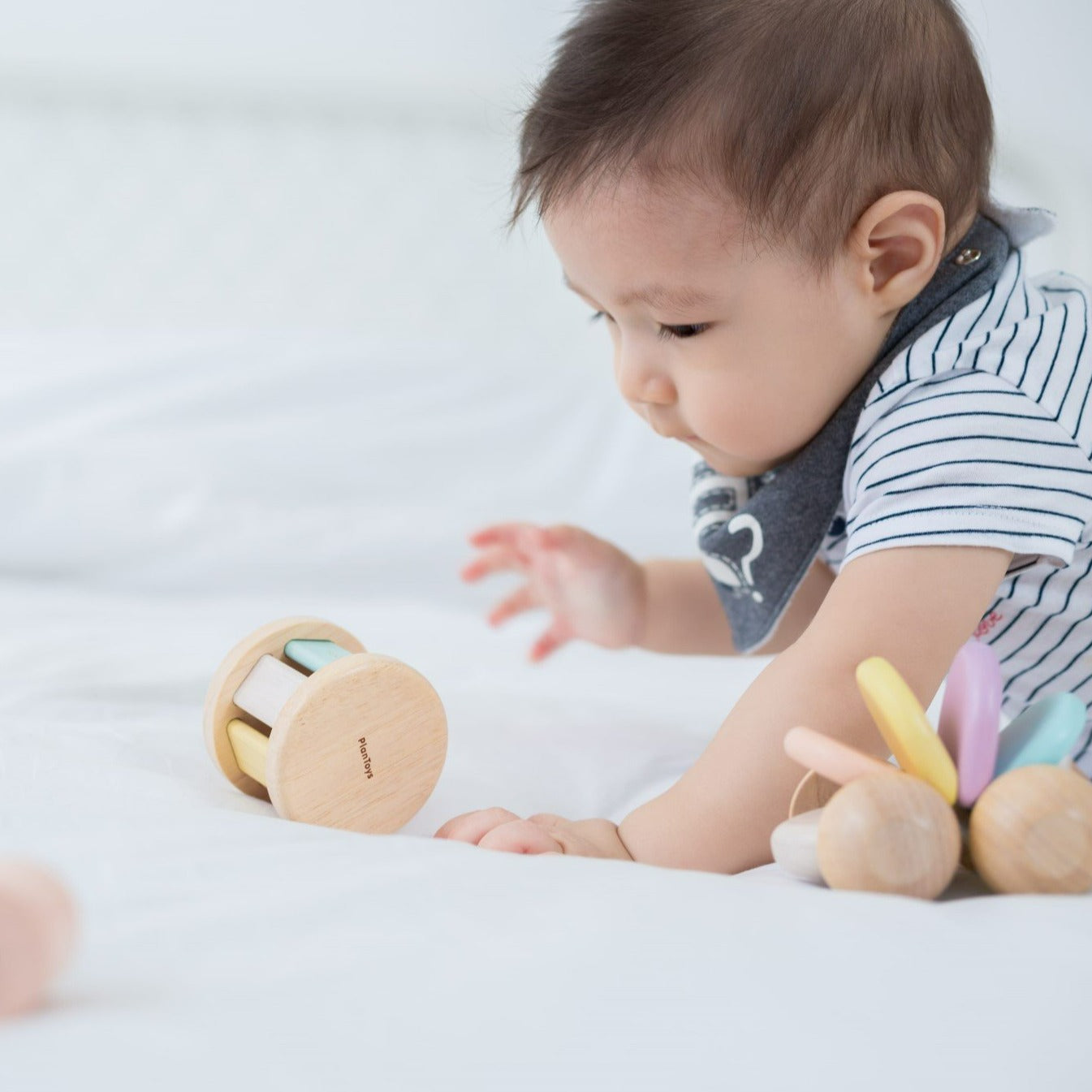 This toy creates sounds when rolled. Stimulates sight and sound.