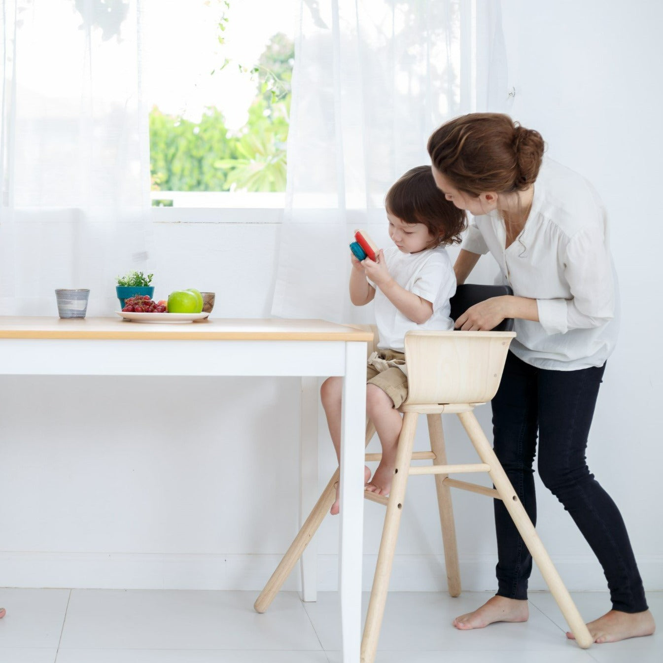 The My First Camera is crafted with PlanWood(TM) a PlanToys material made from surplus sawdust that results in a more flexible water-resistant wood and is pigmented with water-based and natural dyes that are free from harmful chemicals.