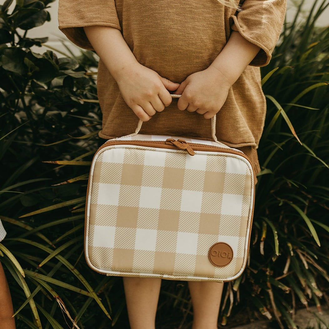 little hands carrying the gingham print mini insulated lunch bag