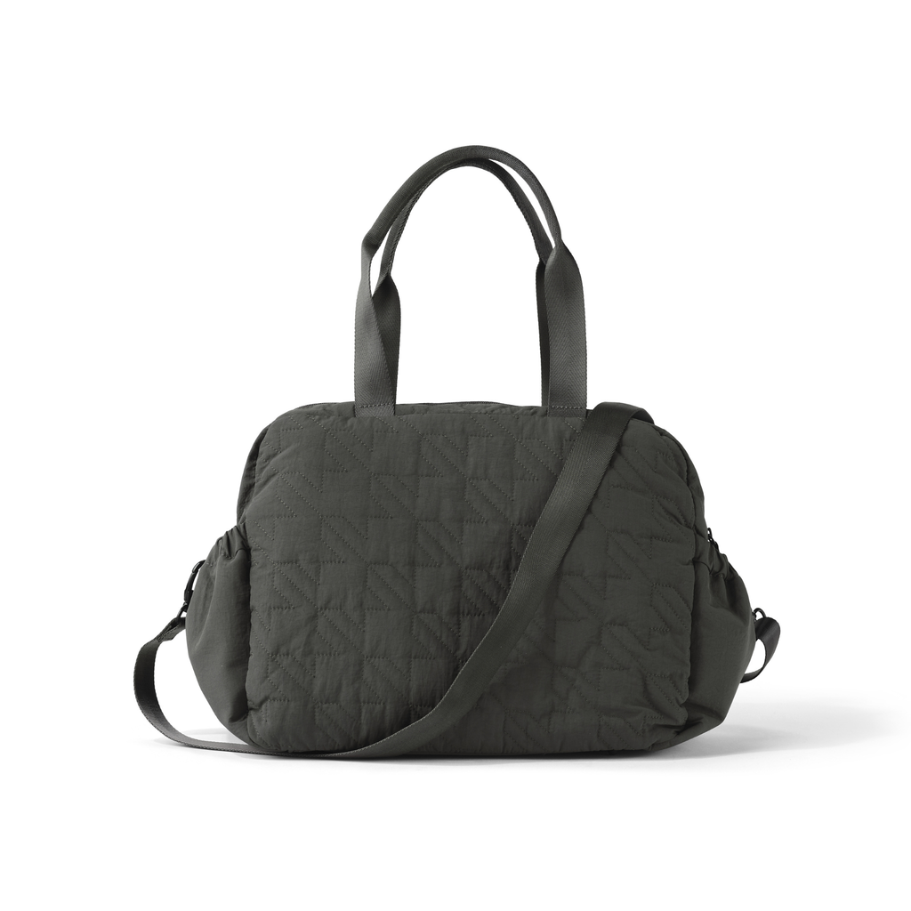 Black quilted handbag with a shoulder strap on a white background